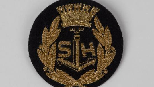 Bröstemblem med styvning och kraschannål.